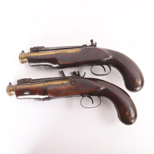 78 - A pair of early 19th century brass barrel flintlock blunderbuss pistols, with sprung bayonets, engra... 