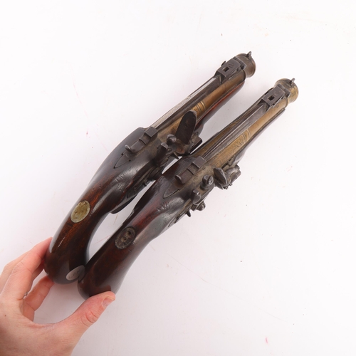 78 - A pair of early 19th century brass barrel flintlock blunderbuss pistols, with sprung bayonets, engra... 