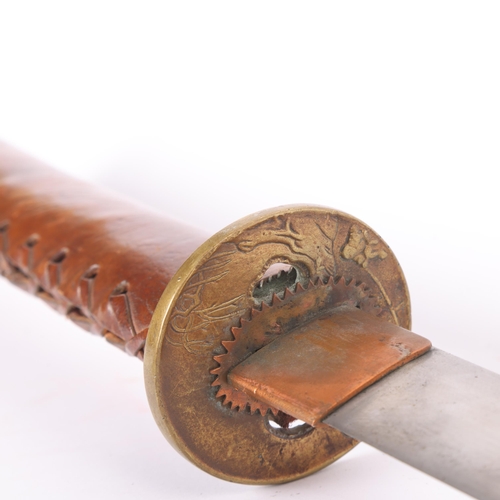 83 - A Second World war period Japanese Katana sword, with leather wrapped grip and bamboo scabbard, leng... 