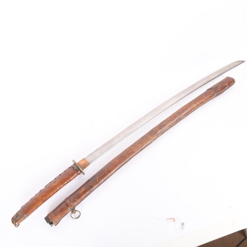 83 - A Second World war period Japanese Katana sword, with leather wrapped grip and bamboo scabbard, leng... 