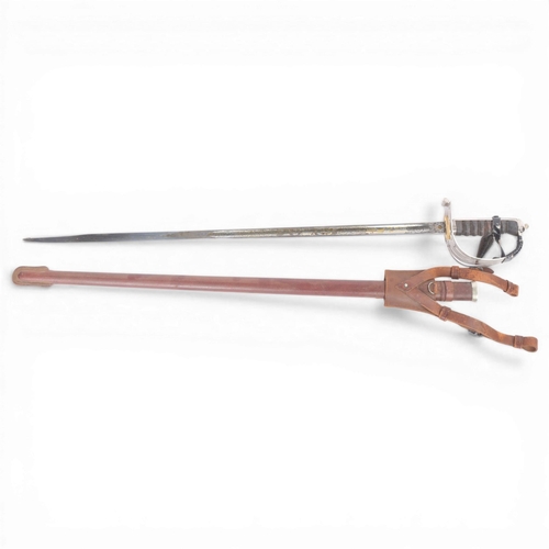 84 - A George VI Army Officer's dress sword, pierced steel basket hilt with shagreen grips, etched blade ... 
