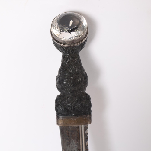 85 - A George V Scottish silver-mounted dirk, with ebonised basket-weave hilt, the pommel set with a cut-... 