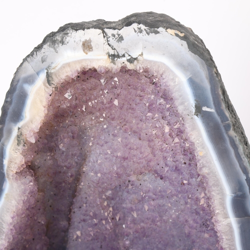 88 - A natural amethyst cavern geode, height 34cm