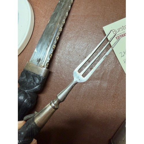 85 - A George V Scottish silver-mounted dirk, with ebonised basket-weave hilt, the pommel set with a cut-... 