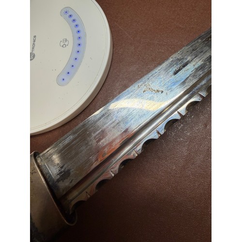 85 - A George V Scottish silver-mounted dirk, with ebonised basket-weave hilt, the pommel set with a cut-... 