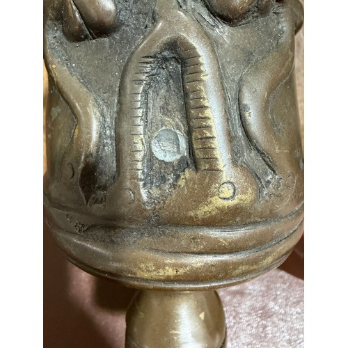 87 - A heavy solid cast-bronze model cannon, on rustic wood stand, barrel length 41cm