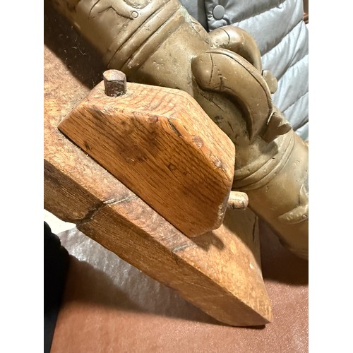 87 - A heavy solid cast-bronze model cannon, on rustic wood stand, barrel length 41cm