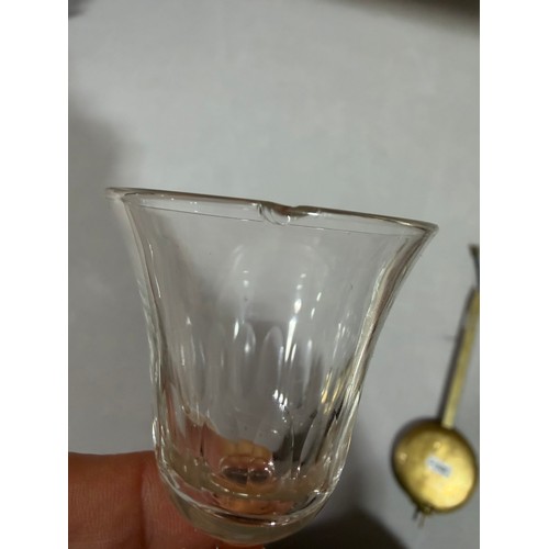 61 - A Victorian oak tantalus with 3 square cut-glass decanters, fold-out lids enclosing 3 liqueur glasse... 