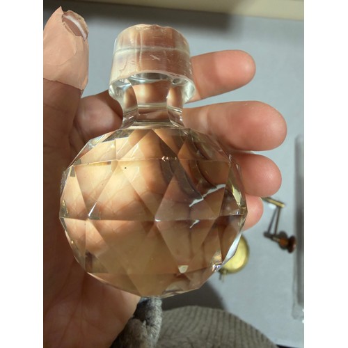 61 - A Victorian oak tantalus with 3 square cut-glass decanters, fold-out lids enclosing 3 liqueur glasse... 