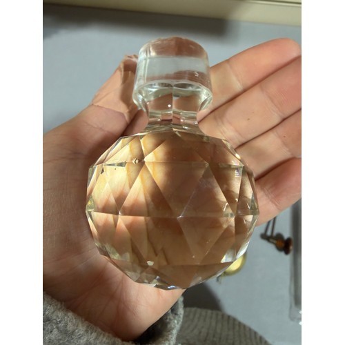 61 - A Victorian oak tantalus with 3 square cut-glass decanters, fold-out lids enclosing 3 liqueur glasse... 