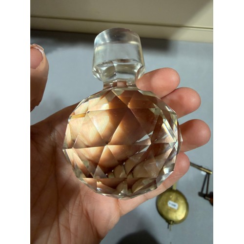 61 - A Victorian oak tantalus with 3 square cut-glass decanters, fold-out lids enclosing 3 liqueur glasse... 