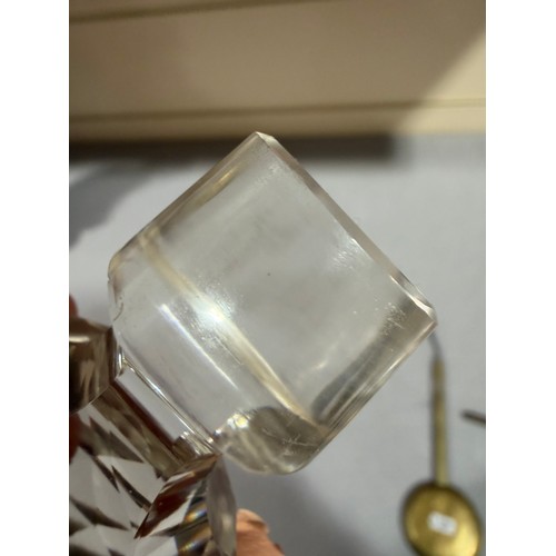 61 - A Victorian oak tantalus with 3 square cut-glass decanters, fold-out lids enclosing 3 liqueur glasse... 