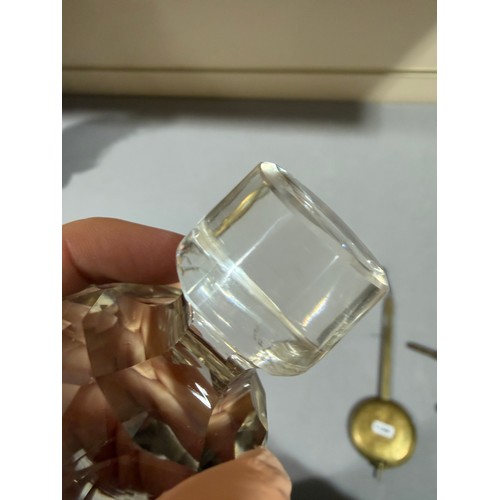 61 - A Victorian oak tantalus with 3 square cut-glass decanters, fold-out lids enclosing 3 liqueur glasse... 