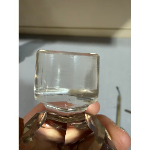 61 - A Victorian oak tantalus with 3 square cut-glass decanters, fold-out lids enclosing 3 liqueur glasse... 