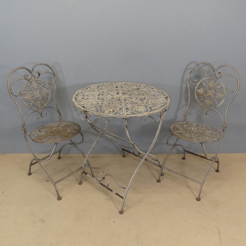 3053 - A modern painted cast iron garden folding circular-topped bistro table, diameter 69cm. Height 76cm, ... 