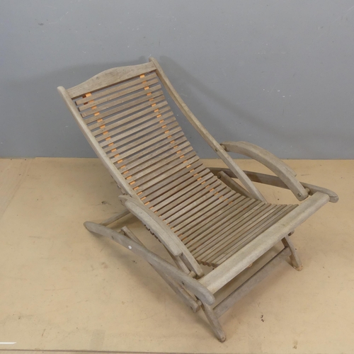 3054 - Amalfi - a weathered teak folding sun lounger with sling seat and maker's label. Overall dimensions ... 