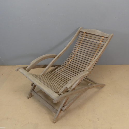 3054 - Amalfi - a weathered teak folding sun lounger with sling seat and maker's label. Overall dimensions ... 
