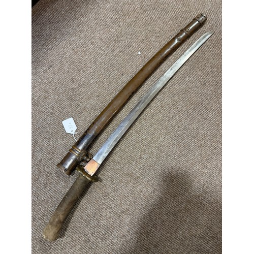 82A - A Second World war period Japanese Wakizashi sword, with leather wrapped grip and bamboo scabbard, l... 