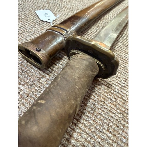 82A - A Second World war period Japanese Wakizashi sword, with leather wrapped grip and bamboo scabbard, l... 