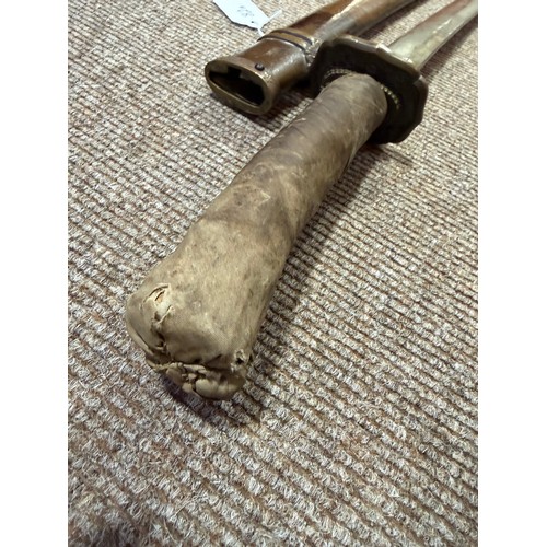 82A - A Second World war period Japanese Wakizashi sword, with leather wrapped grip and bamboo scabbard, l... 