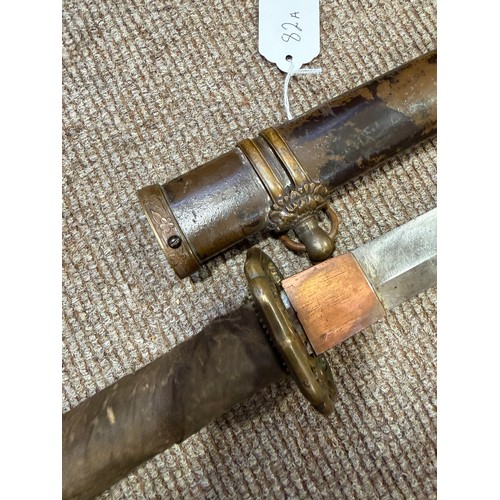 82A - A Second World war period Japanese Wakizashi sword, with leather wrapped grip and bamboo scabbard, l... 