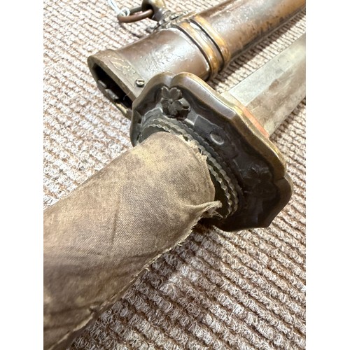 82A - A Second World war period Japanese Wakizashi sword, with leather wrapped grip and bamboo scabbard, l... 