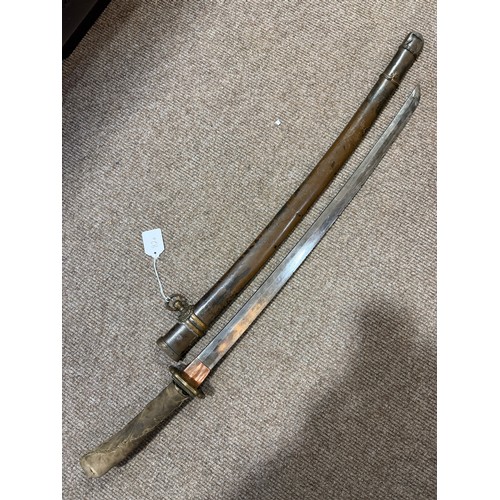 82A - A Second World war period Japanese Wakizashi sword, with leather wrapped grip and bamboo scabbard, l... 