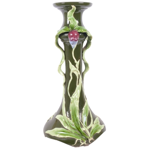 128 - An Art Nouveau Majolica pottery jardiniere stand, with relief iris designs, H69cm (base cracked)