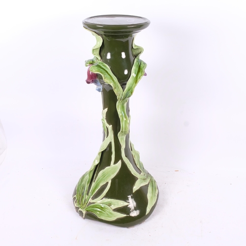 128 - An Art Nouveau Majolica pottery jardiniere stand, with relief iris designs, H69cm (base cracked)
