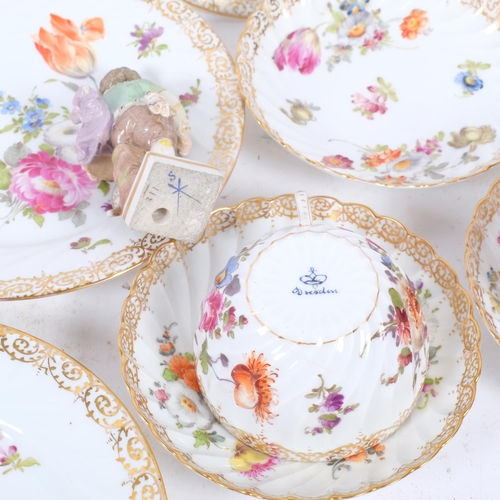 158 - A group of Dresden hand painted and gilded teaware, and a pair of Sitzendorf porcelain figures