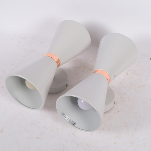 224 - A pair of contemporary mid-century design wall lights, in the form of Diabolos, with copper waistlin... 