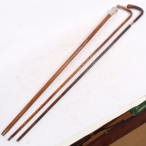 303 - 2 walking canes with silver mounts, and an Indian cane with plated top