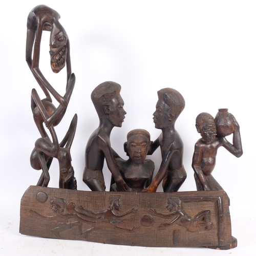 308 - A group of African Tribal carvings, including a Makonde Tribal carved hardwood fertility figure, H41... 