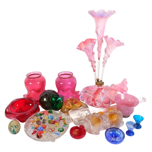 313 - A collection of mixed studio and other glassware, including a cranberry epergne (A/F), various vases... 