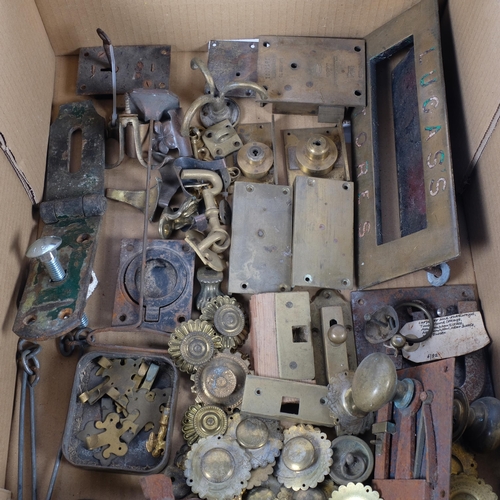 346 - A box of various brassware, including door lock and handles, letterbox, hasp, various brass furnitur... 