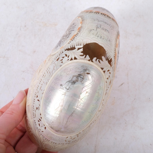 481 - A 19th century nautilus shell, with carved and pierced decoration, inscribed 
