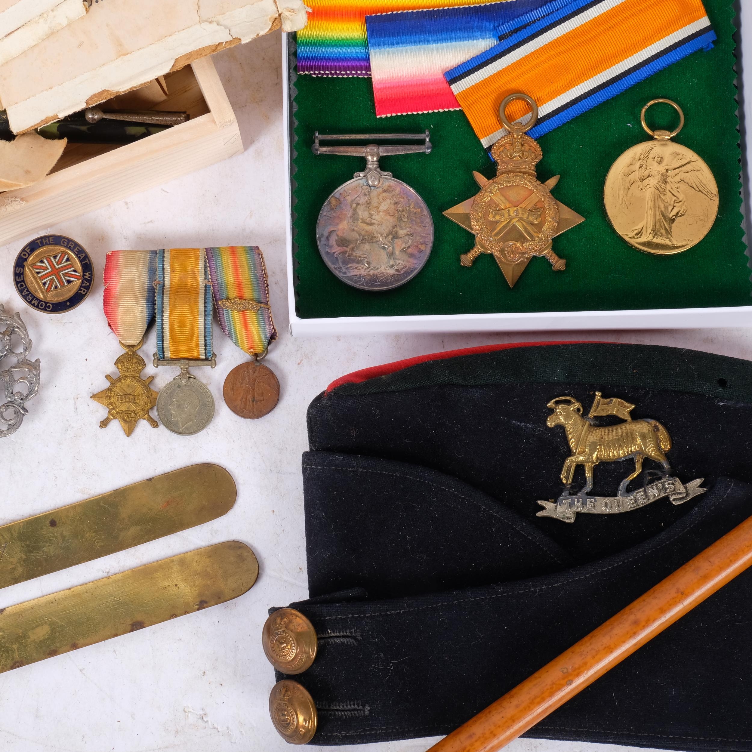 A collection of military items, including a beret for the Queen's Royal ...