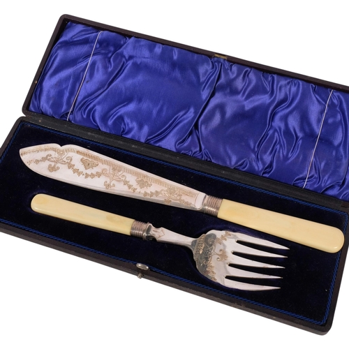 626 - A mid-20th century cased fish serving set, with engraved blades, ivorine handles and silver collars