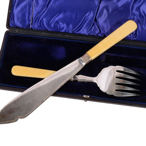 626 - A mid-20th century cased fish serving set, with engraved blades, ivorine handles and silver collars