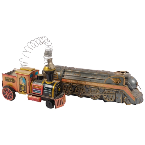 925 - A mid-20th century tinplate model locomotive, by Modern Toys, Japan, and another similar locomotive ... 