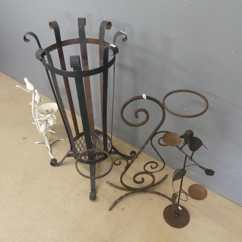 3228 - A wrought iron two tier plant stand. Height 66cm. A cast iron garden waste bin, height 84cm. And 2 b... 