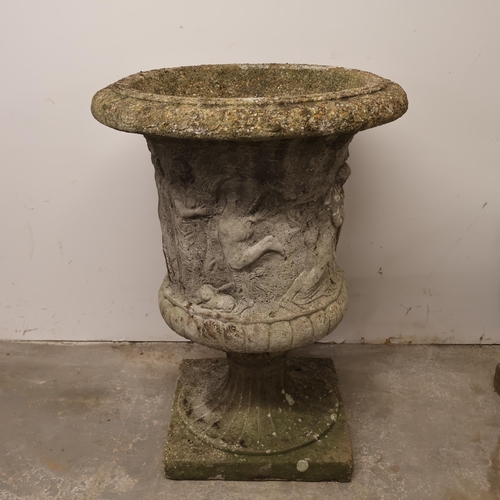 3004 - A weathered concrete two-section garden urn with classical figure decoration. Diameter 61cm, height ... 