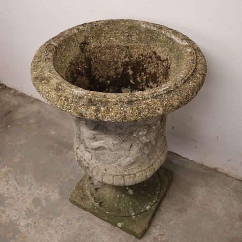 3004 - A weathered concrete two-section garden urn with classical figure decoration. Diameter 61cm, height ... 