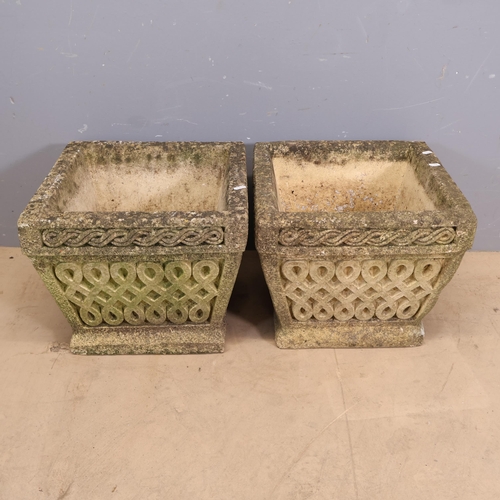 3021 - Cotswold Studios - a pair carved reconstituted stone planters, with Celtic design decoration. Width ... 