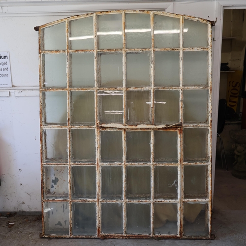 3023 - An antique painted cast iron arch top window, with 36 panes. Width 144cm, height 185cm. WITH THE OPT... 
