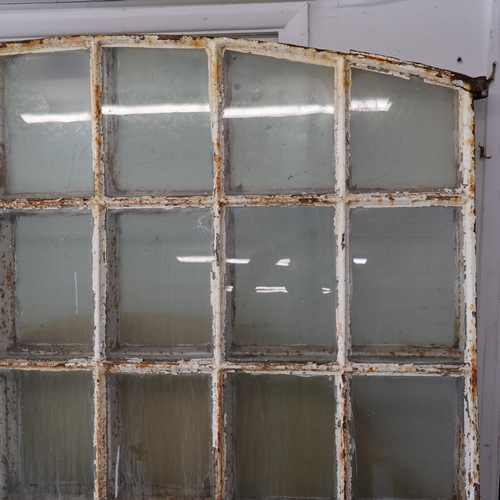 3023 - An antique painted cast iron arch top window, with 36 panes. Width 144cm, height 185cm. WITH THE OPT... 