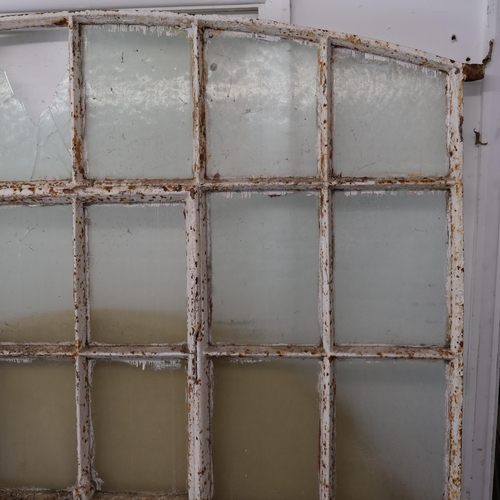 3024 - An antique painted cast iron arch top window, with 36 panes. Width 144cm, height 185cm.