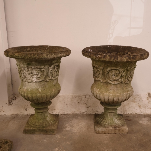 3026 - A pair of large and impressive two section campana style urns in reconstituted stone with foliate de... 