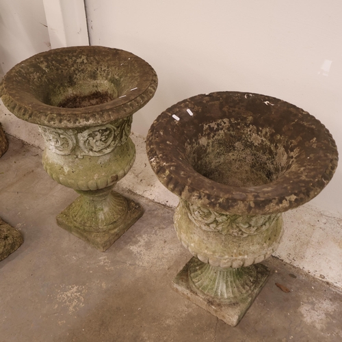 3026 - A pair of large and impressive two section campana style urns in reconstituted stone with foliate de... 