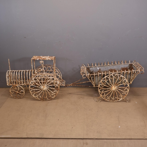 3030 - A wrought iron wirework painted two section planter in the form of a train with galvanised planter t... 